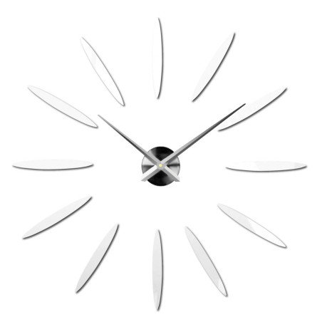 Un ceas plasat creativ care creează un efect de rază de soare folosind elemente aurii. Un ceas plasat creativ care creează un efect de rază de soare folosind elemente aurii.